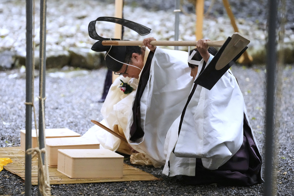 Priests and officials in the Shinto priesthood march during Yamaguchisai, a kickoff ceremony of the Shikinen Sengu ritual, which concludes in 2033 (AP)